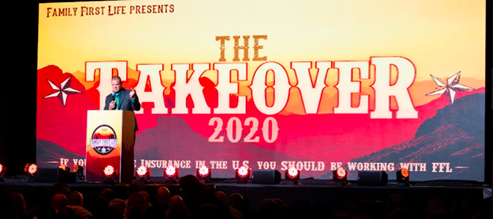 Shawn Meaike speaking at podium in front of Takeover 2020 banner